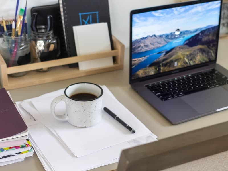 Financial planning with business documents and laptop - JLC Capital Group financing solutions